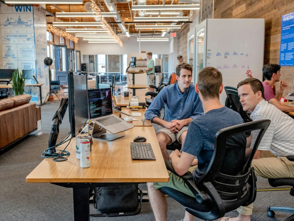 three men sitting on chair beside tables skill in workplace fun facts