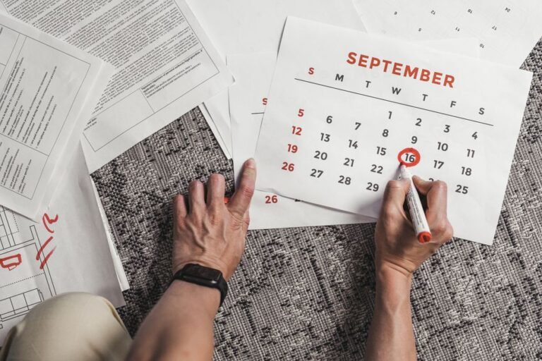 A wall calendar with several dates circled in red marker