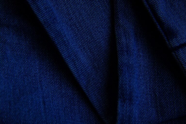 Close-up macro shot of denim fabric showing its diagonal twill weave texture