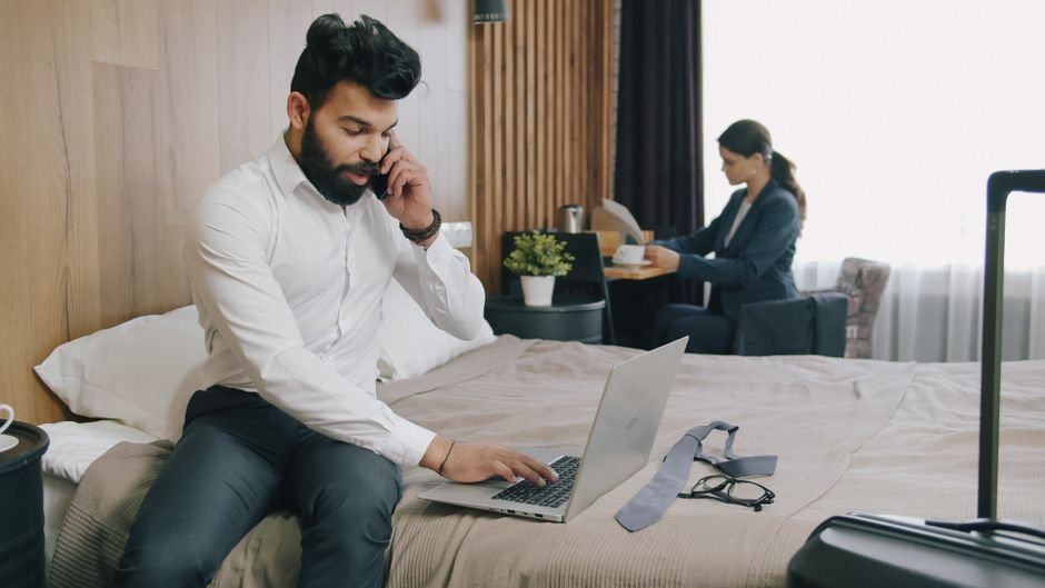 A person scrolling through hotel reviews on a smartphone